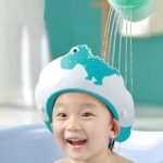 LONGMIRE Baby Shower Cap for Kids Hair Washing Shield, Toddler Bath Hat, Shampoo Visor, Head Protector - Cute Dinosaur Shape Makes Bath More Fun - Blue (1 Pack) (AA1102/93)