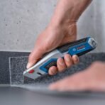 BOSCH Professional Universal Retractable Knife with Blade Storage, Versatile for Multiple Uses, Comes with 3 Trapezoid Blades (AA1104/288) - Image 2