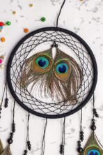 Colour	Black Brand	THE URBAN CRAFTIQUE Occasion	Home Decoration Material	Thread, Beeds, Wooden ring & Peacock Feather Theme	Traditional Cartoon Character	Traditional Dream Catcher Style	Traditional Product Dimensions	2D x 25W x 35H Centimeters Target Audience	Adult Included Components	Dream Catcher - Image 4